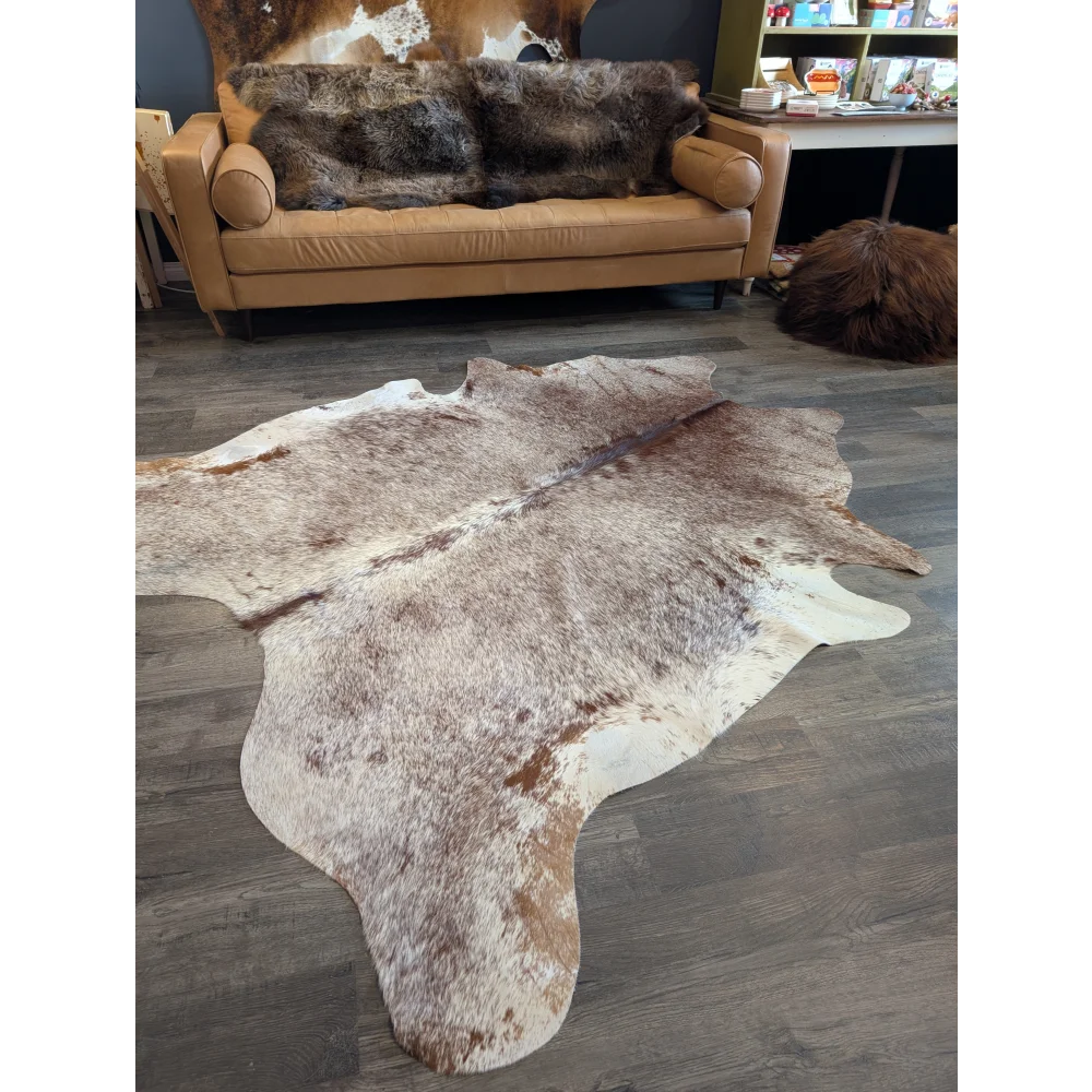 Extra large natural brown and white cowhide rug with textured fur surface perfect for beautiful rugs and large cowhide lovers