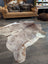 Extra large natural brown and white cowhide rug with textured fur surface perfect for beautiful rugs and large cowhide lovers