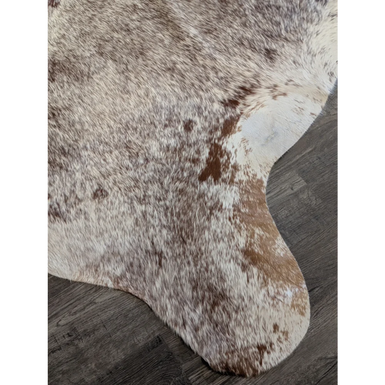 Extra large cowhide rug with white and brown mottled fur perfect for beautiful rugs and large cowhide decor