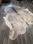 Extra large natural-toned large cowhide rug with mottled beige brown and white fur perfect for beautiful rugs collection