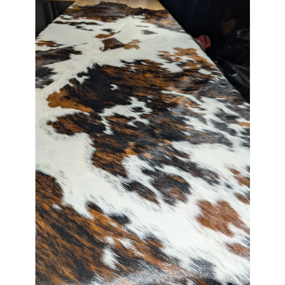 Extra large Tricolor cowhide rug with brown, black, white patches, soft underfoot