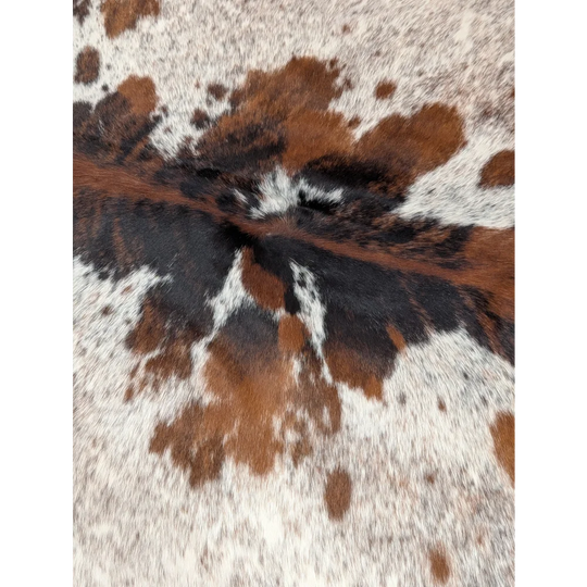 Extra large cowhide rug tricolour101 with brown black and white spots and natural fur texture for rustic charm and unique characteristics