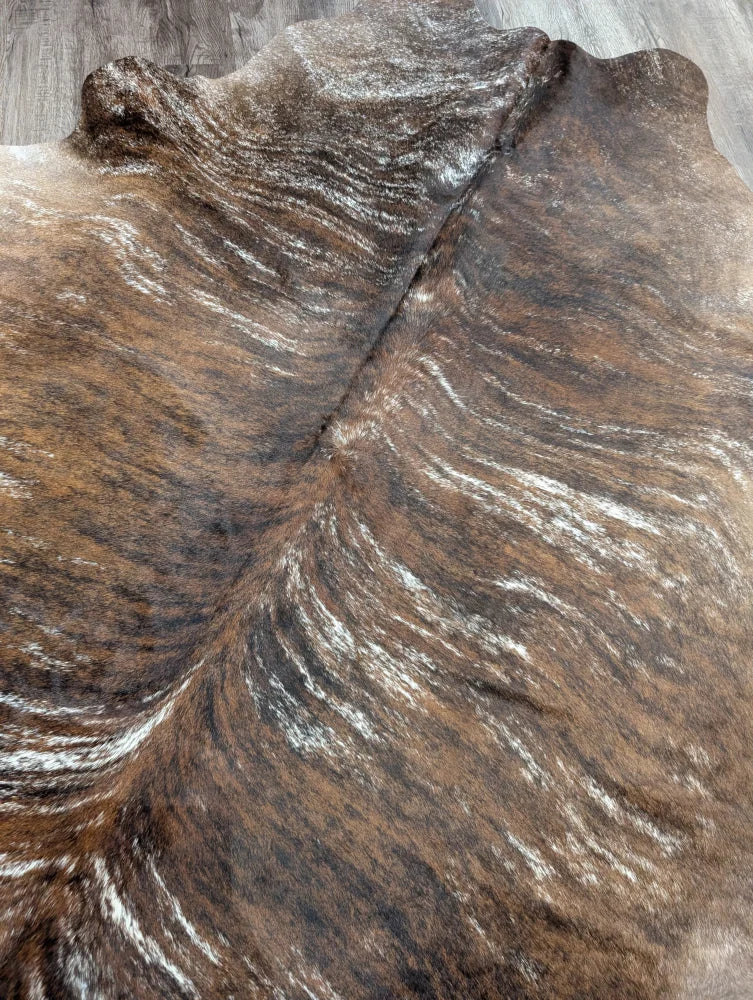 Brown and white extra large cowhide rug with rustic charm and unique natural irregular edges tricolour117 90 x 82 inches