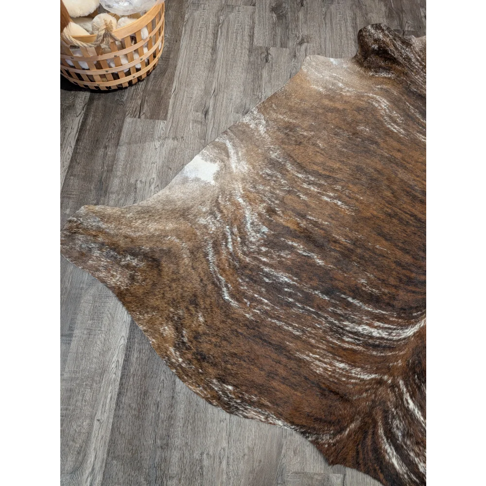 Tricolour 117 extra large cowhide rug with brown and white swirling patterns adds rustic charm and unique characteristics