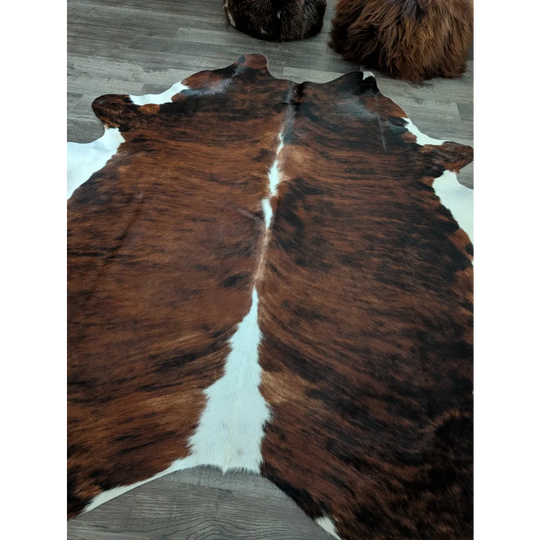 Brown and white tricolour16 extra large cowhide rug with natural fur texture measuring 86 by 82 inches