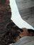 Brown and black tricolour#16 extra large cowhide rug with white stripe measuring 86 by 82 inches