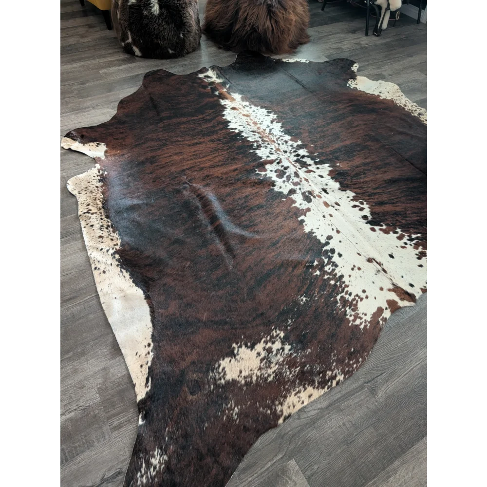 Brown and white extra large cowhide rug tricolour 34 with natural irregular patterns perfect for beautiful rugs