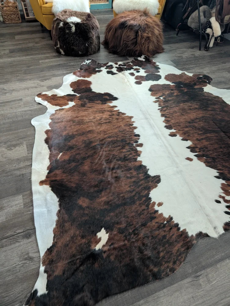 Brown and white extra large cowhide rug tricolour#49 with natural fur texture measuring 96 by 82 inches