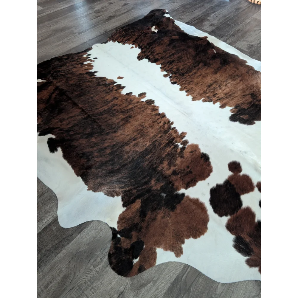 Brown and white extra large cowhide rug with natural fur texture perfect as a large cowhide floor decor