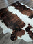 Brown and white extra large cowhide rug with natural fur texture perfect as a large cowhide floor decor