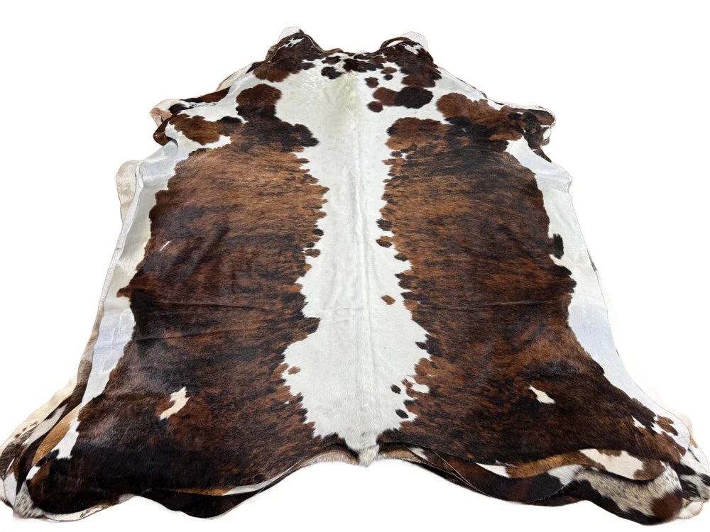 Brown and white beautiful rugs featuring extra large cowhide with natural fur texture for stylish decor