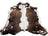 Brown and white beautiful rugs featuring extra large cowhide with natural fur texture for stylish decor
