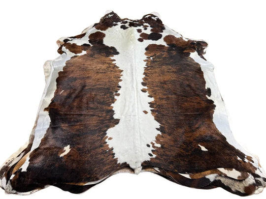 Brown and white beautiful rugs featuring extra large cowhide with natural fur texture for stylish decor