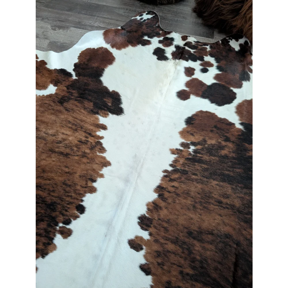 Brown and black spotted extra large cowhide rug tricolour49 with natural textured surface 96 by 82 inches