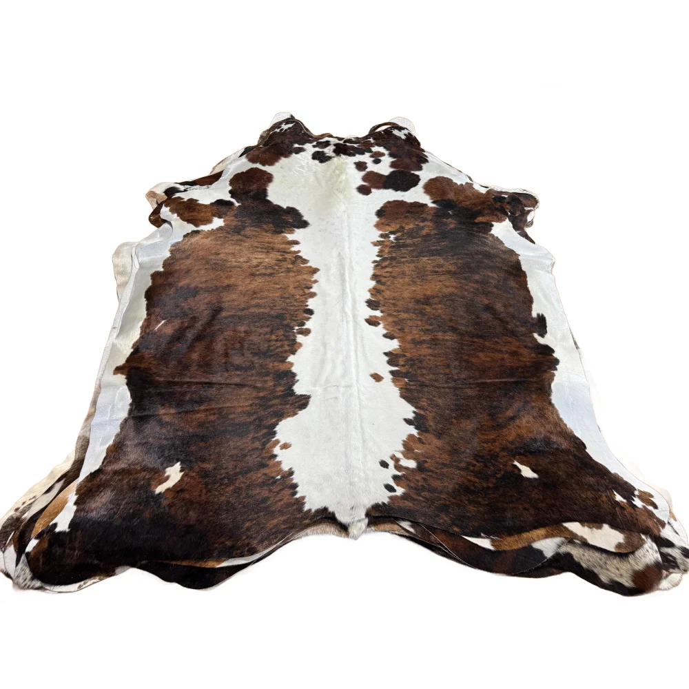 Brown and white beautiful rugs featuring extra large cowhide with natural fur texture for stylish decor