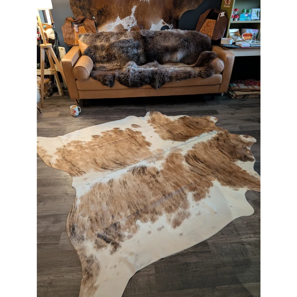 Extra large brown and white cowhide rug triColour553 with natural fur texture perfect as a large cowhide decor piece
