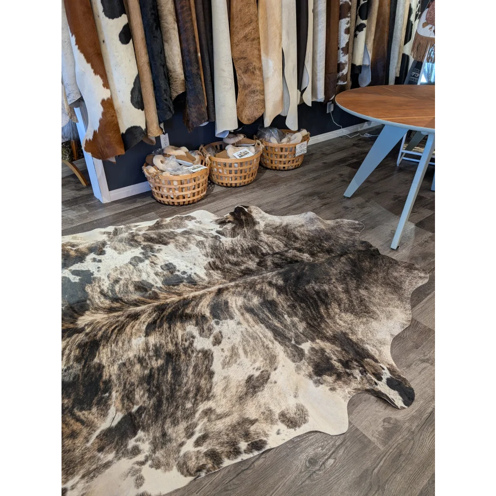 Extra large cowhide rug tricolour 95 with rustic charm features unique dark brown black and cream mottled patches