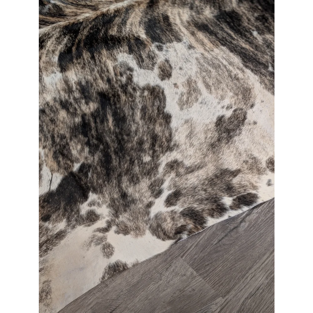 Extra large cowhide rug tricolour95 with rustic charm and unique black and white mottled natural leather pattern