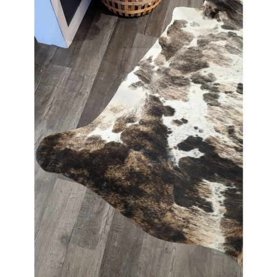 Brown and white extra large cowhide rug tricolour95 with natural fur texture and rustic charm unique characteristics