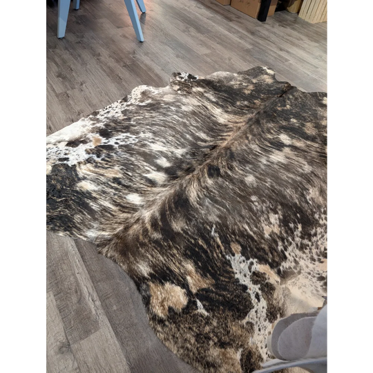 Extra large cowhide rug tricolour 99 with rustic charm and unique mottled black white and tan patches