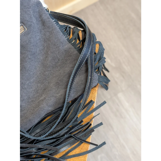 Denim-fringed tumbleweed 2 shoulder bag with smoky charcoal hand tooled patch and zippered pocket straps