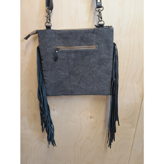 Dark gray suede tumbleweed 2 crossbody bag with smoky charcoal leather fringe and zippered pocket hand tooled details