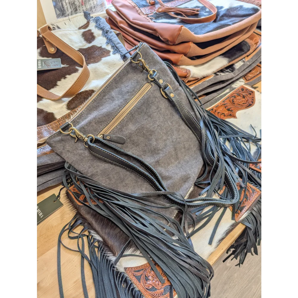 Gray denim crossbody bag tumbleweed 2 with black leather fringe brass hardware smoky charcoal hand tooled zippered pocket