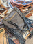 Gray denim crossbody bag tumbleweed 2 with black leather fringe brass hardware smoky charcoal hand tooled zippered pocket