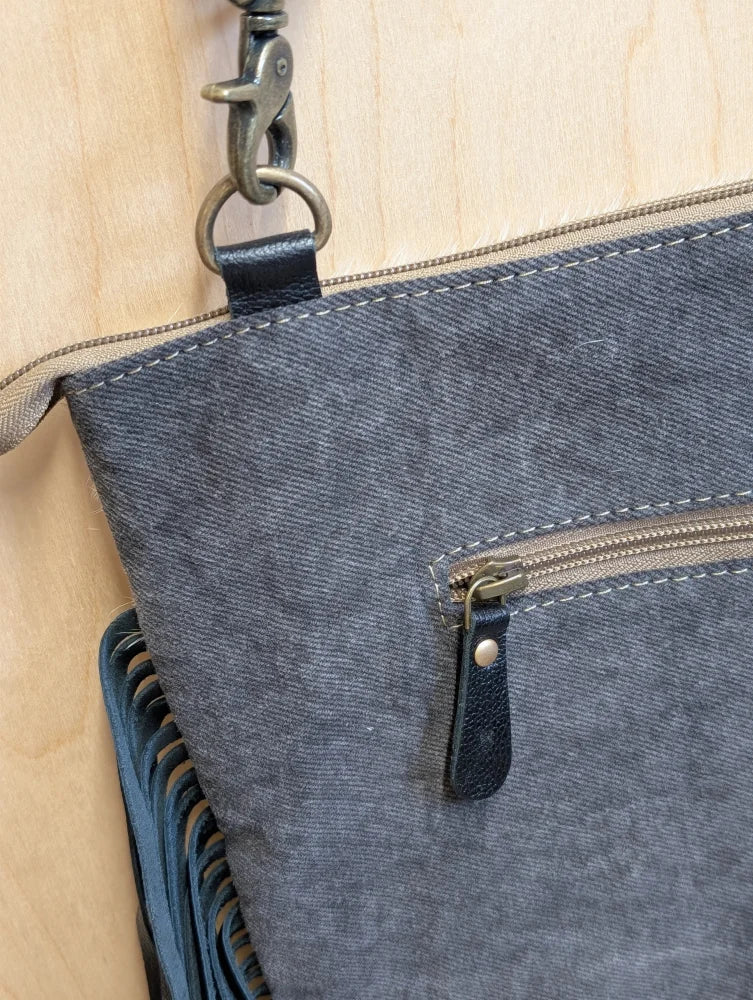 Tumbleweed 2 smoky charcoal denim shoulder bag with black leather accents zippered pocket and hand tooled tassel purse