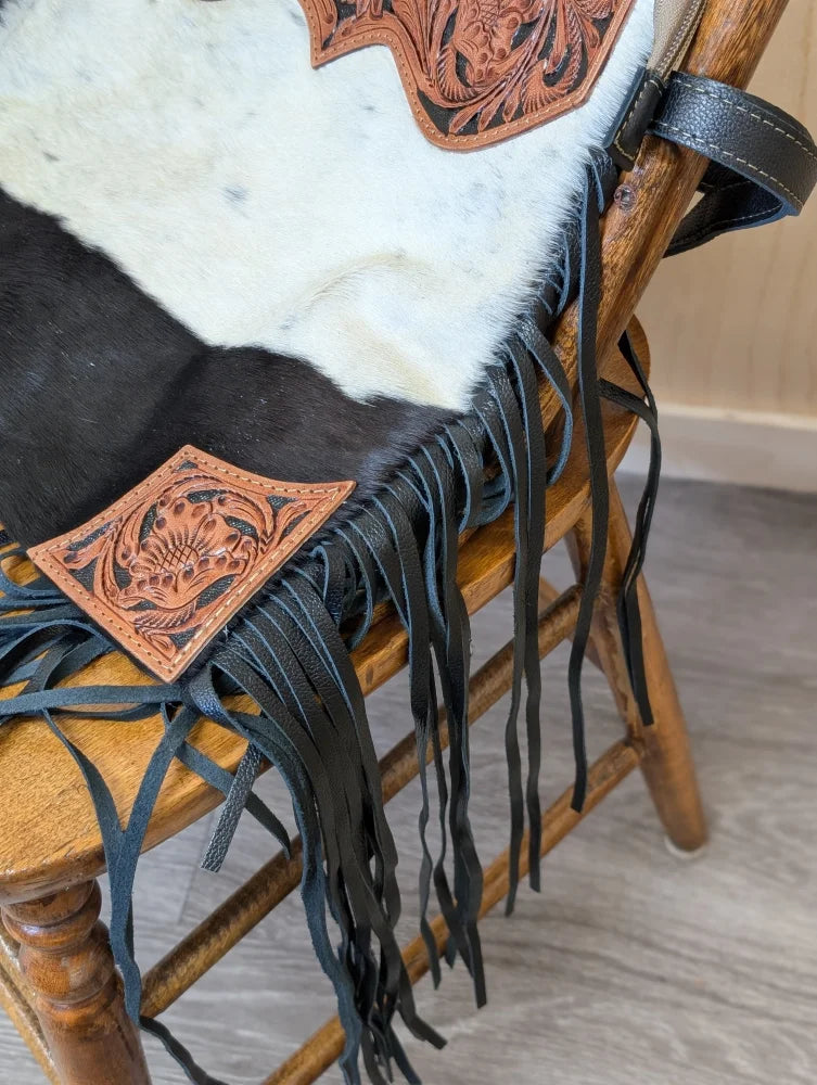 Tumbleweed 2 black and white cowhide fringe bag with hand tooled tan leather floral accents and zippered pocket