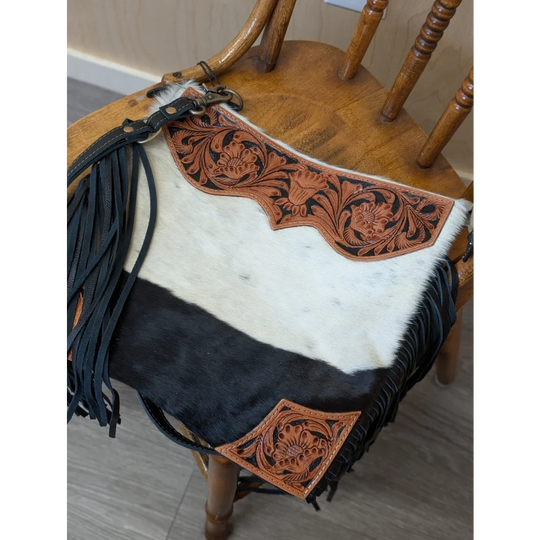 Tumbleweed 2 cowhide crossbody bag with smoky charcoal black and white fur, hand tooled tan leather, and zippered pocket