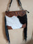 Tumbleweed 4 black and white cowhide crossbody bag with brown hand tooled floral embroidery smoky charcoal fringe and zippered pocket