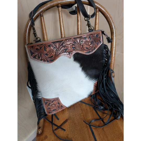 Tumbleweed 4 smoky charcoal black and white cowhide crossbody bag with hand tooled brown floral embroidery and zippered pocket