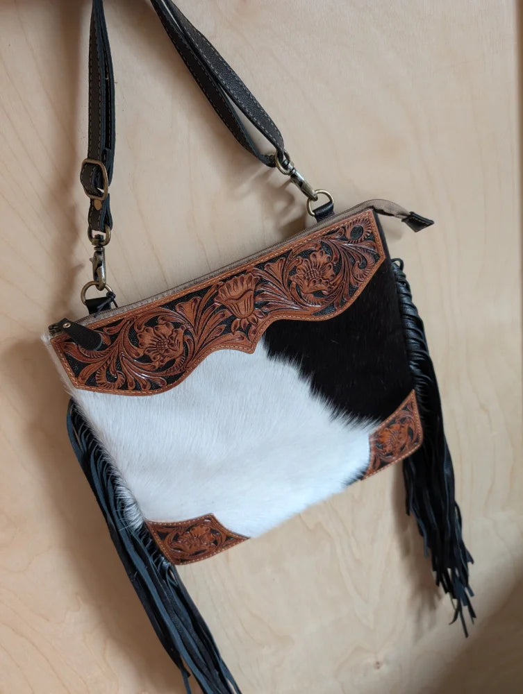 Tumbleweed #4 crossbody bag with smoky charcoal black and white cowhide, hand tooled brown floral embroidery, and zippered pocket