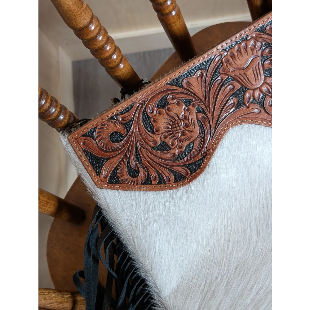 Tumbleweed 4 hand tooled brown leather tassel purse with smoky charcoal zippered pocket and white cowhide texture