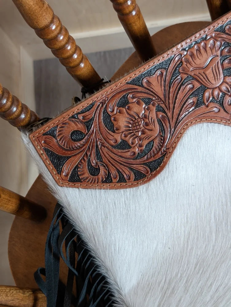 Tumbleweed 4 hand tooled brown leather tassel purse with smoky charcoal zippered pocket and white cowhide texture