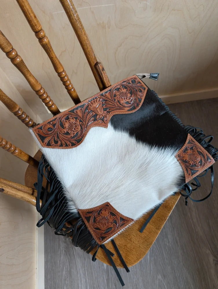 Tumbleweed 4 cowhide clutch with hand tooled brown floral embroidery black fringe and smoky charcoal zippered pocket