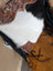 Tumbleweed 4 gorgeous tassel purse in smoky charcoal black and white cowhide with hand tooled brown leather and zippered pocket