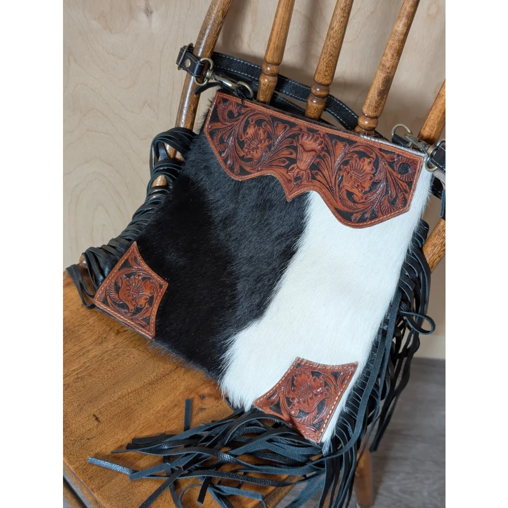 Tumbleweed #5 gorgeous tassel purse with black and white cowhide, hand tooled reddish brown leather, smoky charcoal fringe, and zippered pocket