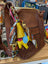 Brown leather crossbody bag with colorful patterned scarf and yellow tassel charm free with 160 spend