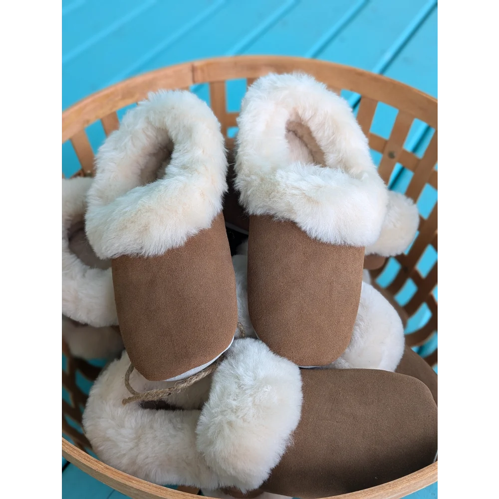 Tan UGG sheepskin slippers with soft fluffy clouds lining, size 10US