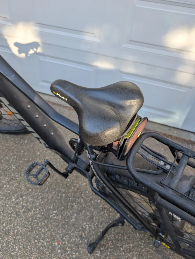 Comfortable sheepskin bicycle seat with black leather saddle, gel padding, and ergonomic design