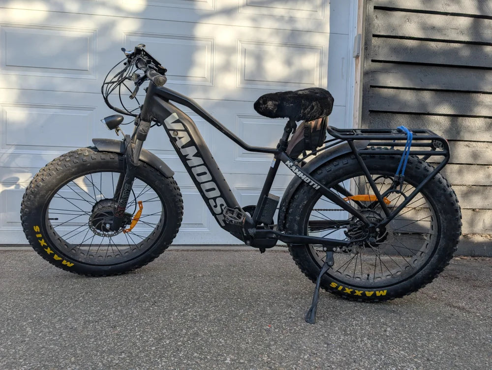 VanMoof S3 electric bike with sheepskin bicycle seat cover