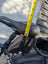 Black merino sheepskin bicycle seat with yellow tape for height adjustment
