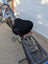 Black mesh sheepskin bicycle seat cover with elastic edges and reflective stripes