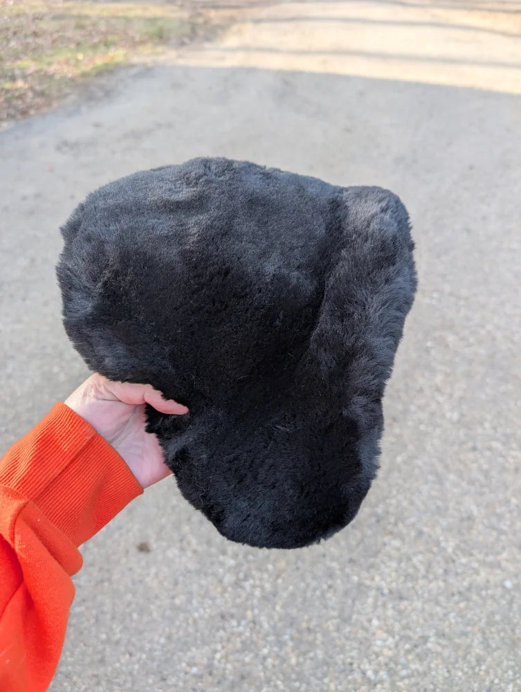 Cozy black fur sheepskin bicycle seat with plush ear flap hat