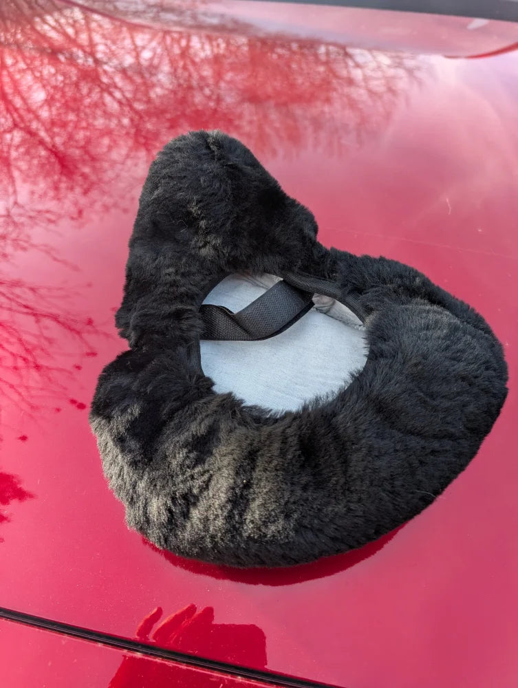 Cozy black gray fur neck warmer with white lining on merino sheepskin bicycle seat