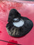 Cozy black gray fur neck warmer with white lining on merino sheepskin bicycle seat