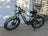 2019 fat tire e-bike with black frame, yellow wheels, and merino sheepskin bicycle seat