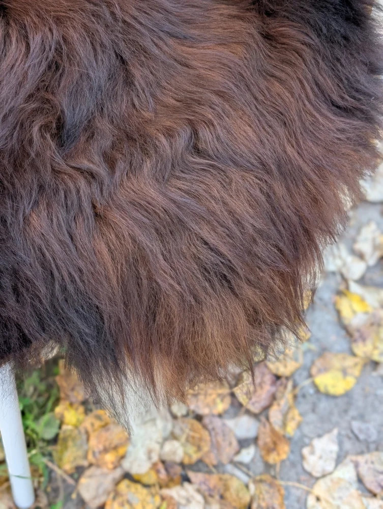 Thick fluffy brown wool icelandic sheepskin coat with soft natural texture large natural dark rusty color